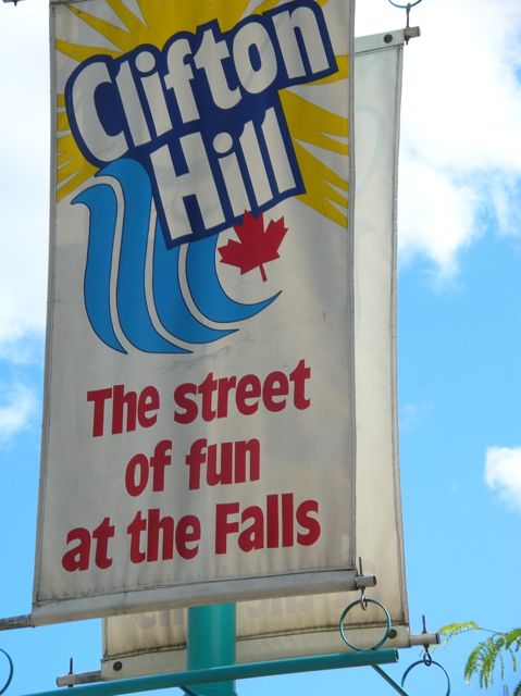 Large pole banner the says Clifton Hill: The street of fun at the Falls