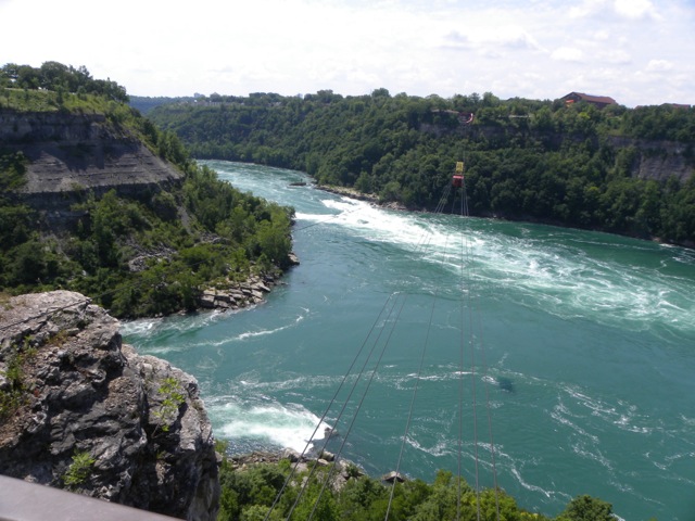 Deep gorge with swirling water at bottom